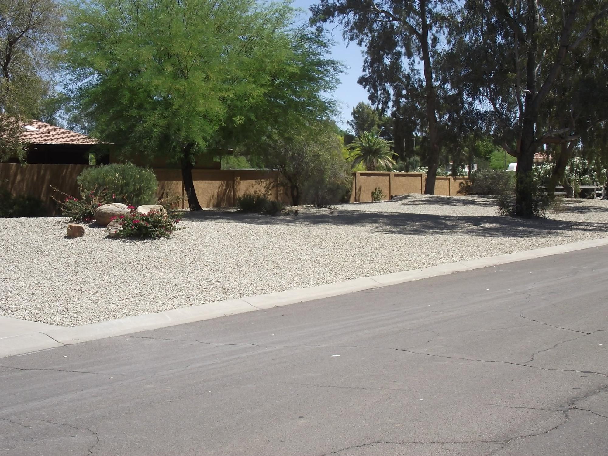 White decorative gravel front yard along the street at an Arizona home